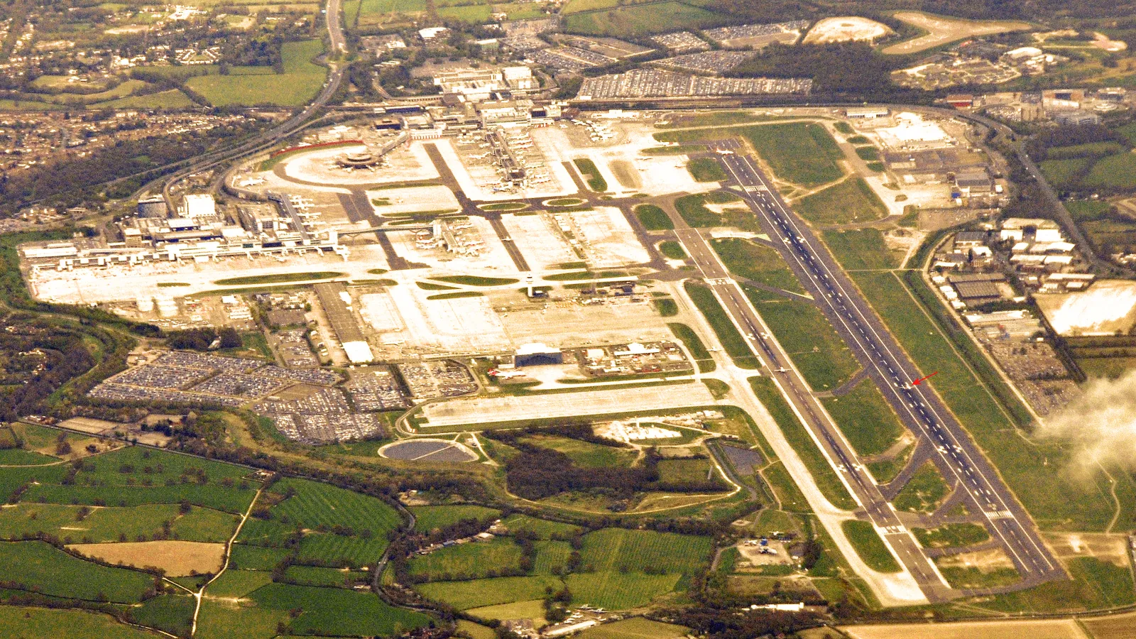 Aerial view of Gatwick Airport runway and terminals, West Sussex - Southampton cruise port to Gatwick transfer