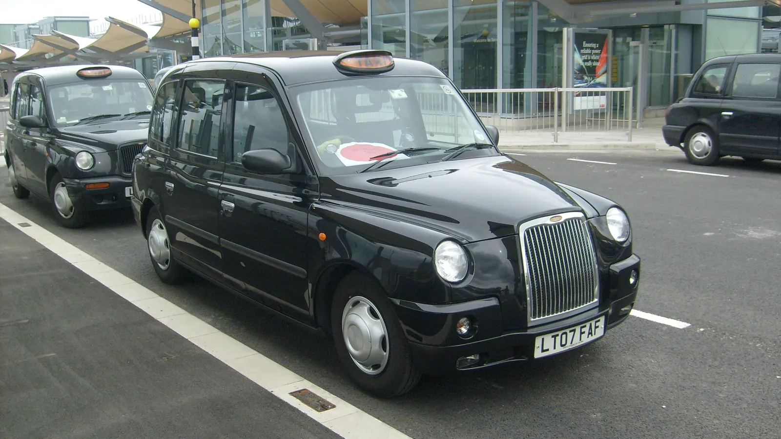 Taxi at the Heathrow Airport Terminal 5 forecourt - Southampton cruise port to Heathrow transfer