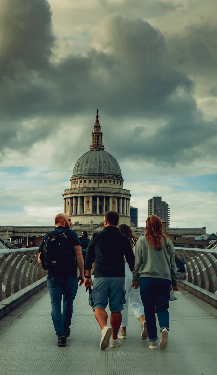 Family walking along a London street towards St Paul’s Cathedral
