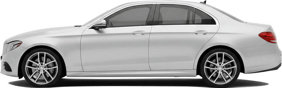 Side view of a white executive Mercedes saloon used for airport transfers
